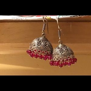 Jhumka earrings.